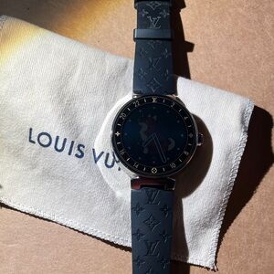 Louis Vuitton with black /midnight blue strap with original receipts.